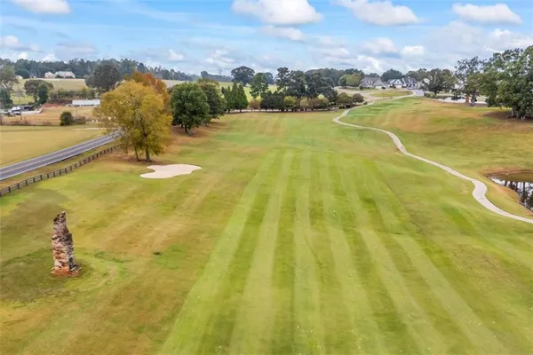 a view of a livingroom with furniture and hardwood floor