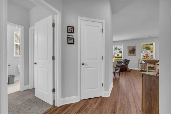 a living room with fireplace furniture and a wooden floor