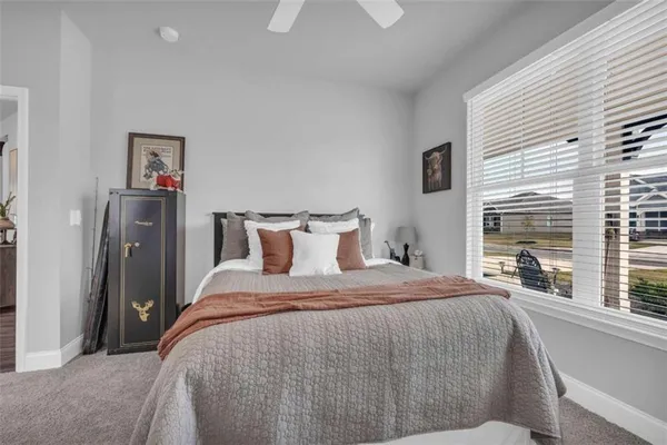 a living room with furniture a rug and a fireplace