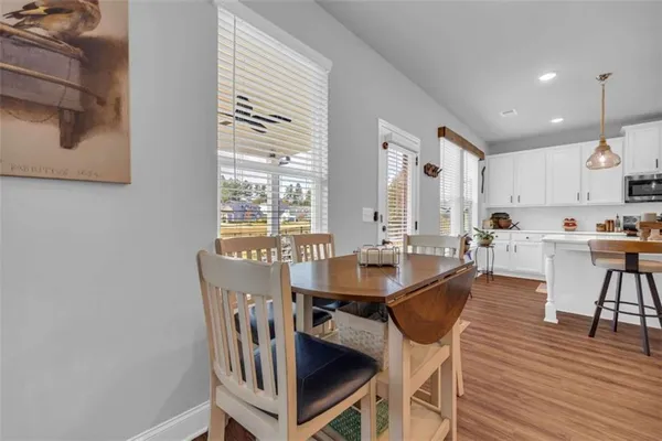 a kitchen with counter space and wooden floor