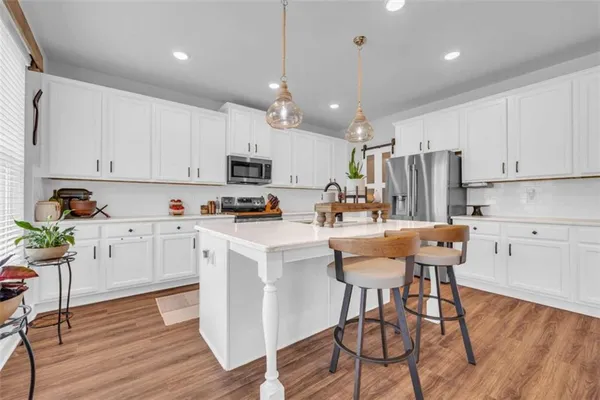 a bathroom with a sink toilet and vanity