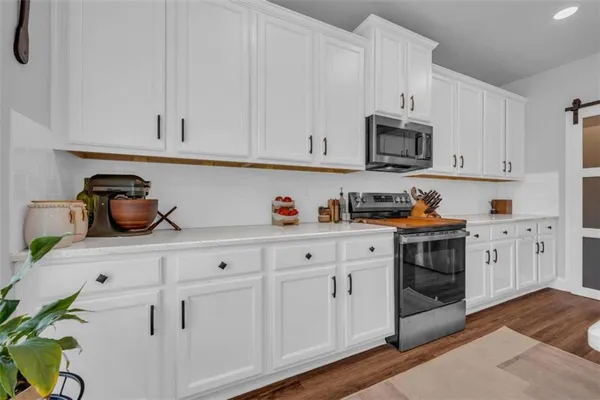 a bathroom with a double vanity sink toilet and shower