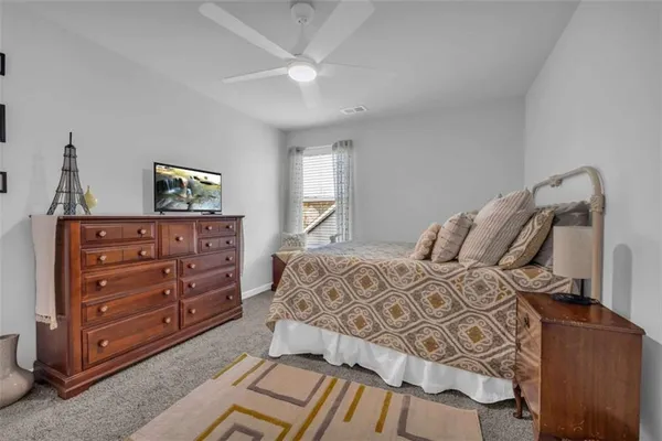 a white bath tub sitting next to a window