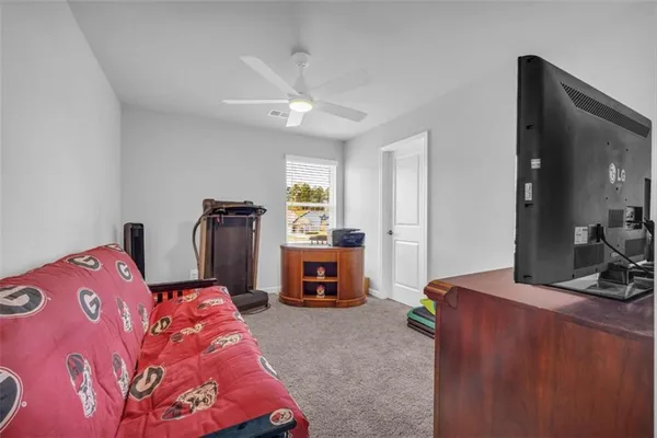 a large white room with cabinets