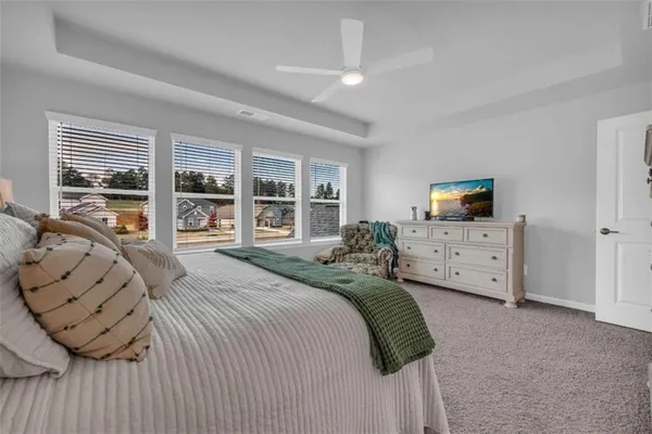 a front view of a house with a yard table and chairs