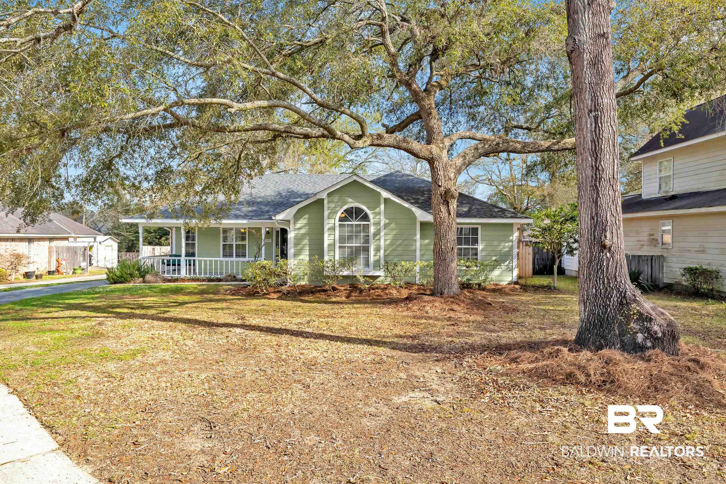 6616 Conde Court Mobile, AL 36695 - Photo 2 of 27 View of front of property featuring a porch, a shingled roof, and a front lawn