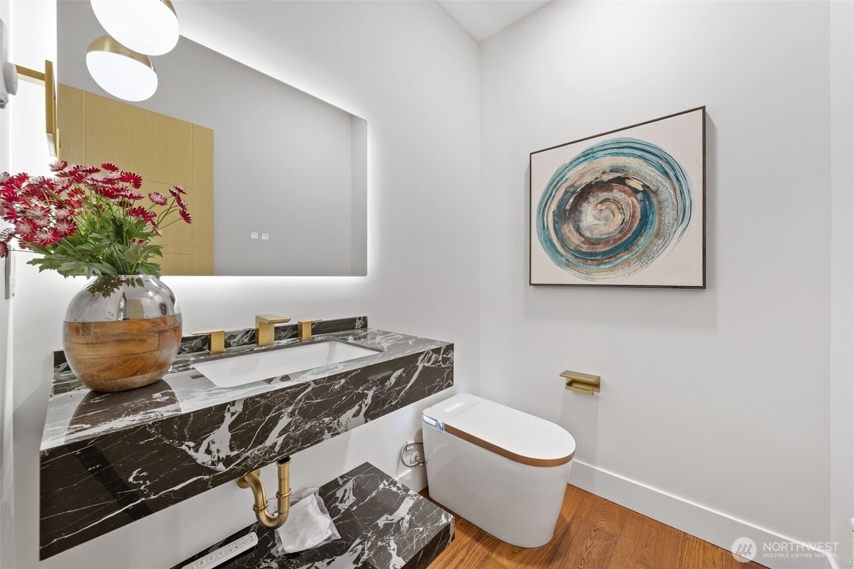 7903 240th Street Southwest Edmonds, WA 98026 - Photo 11 of 35 a bathroom with a granite countertop toilet and a sink