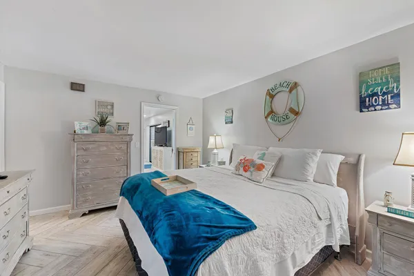 a bedroom with a bed and a desk