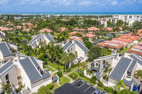 an aerial view of residential houses with outdoor space