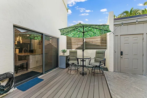 a view of a chairs and table in a patio