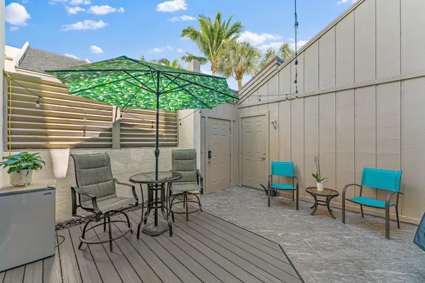 a patio with table and chairs
