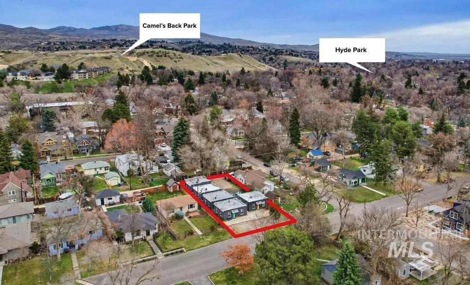 2104 North 18th Street Boise, ID 83702 - Photo 14 of 19 Aerial view of residential area with property boundaries highlighted and a mountainous background