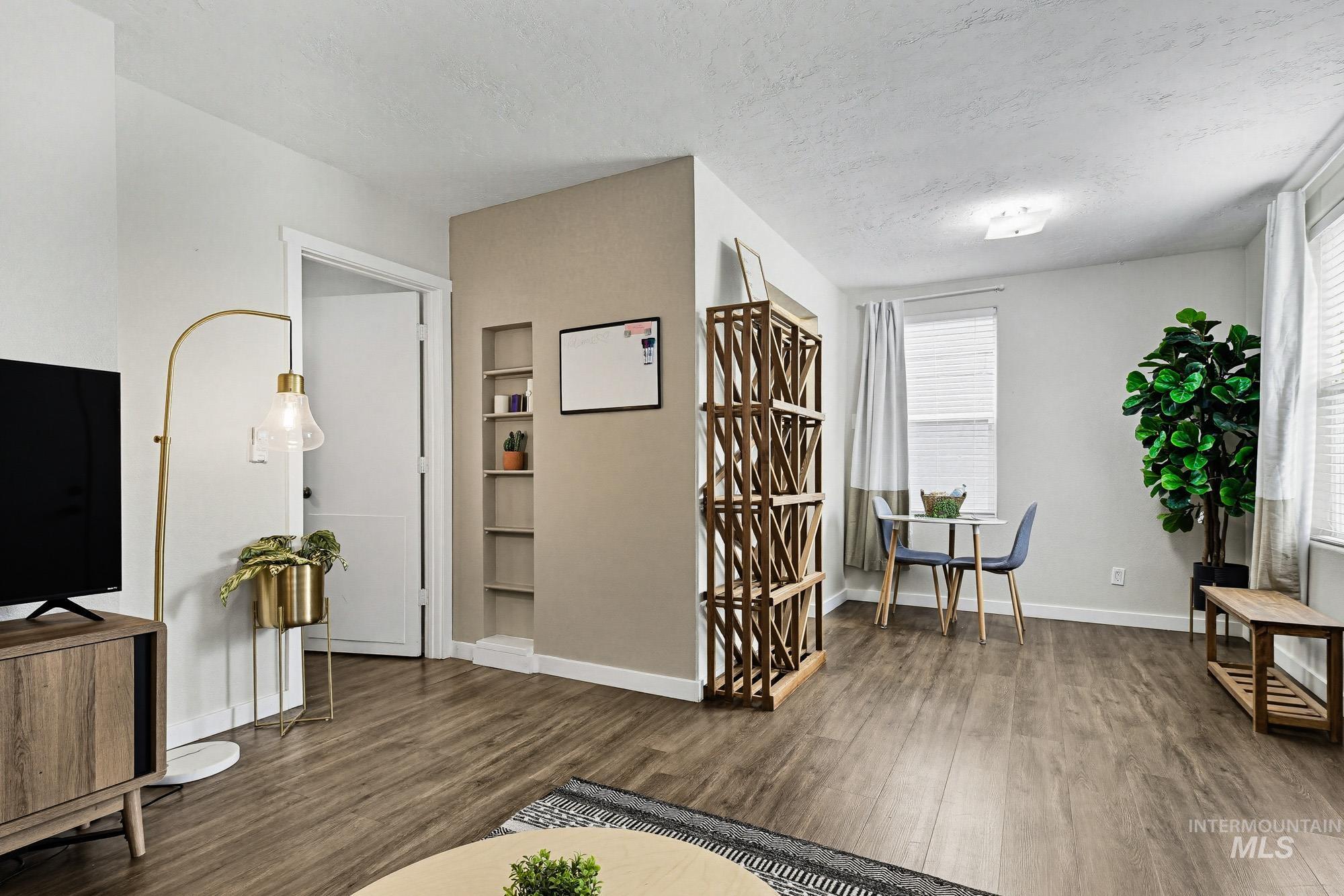 2104 North 18th Street Boise, ID 83702 - Photo 6 of 19 Sitting room with dark wood-type flooring and a textured ceiling