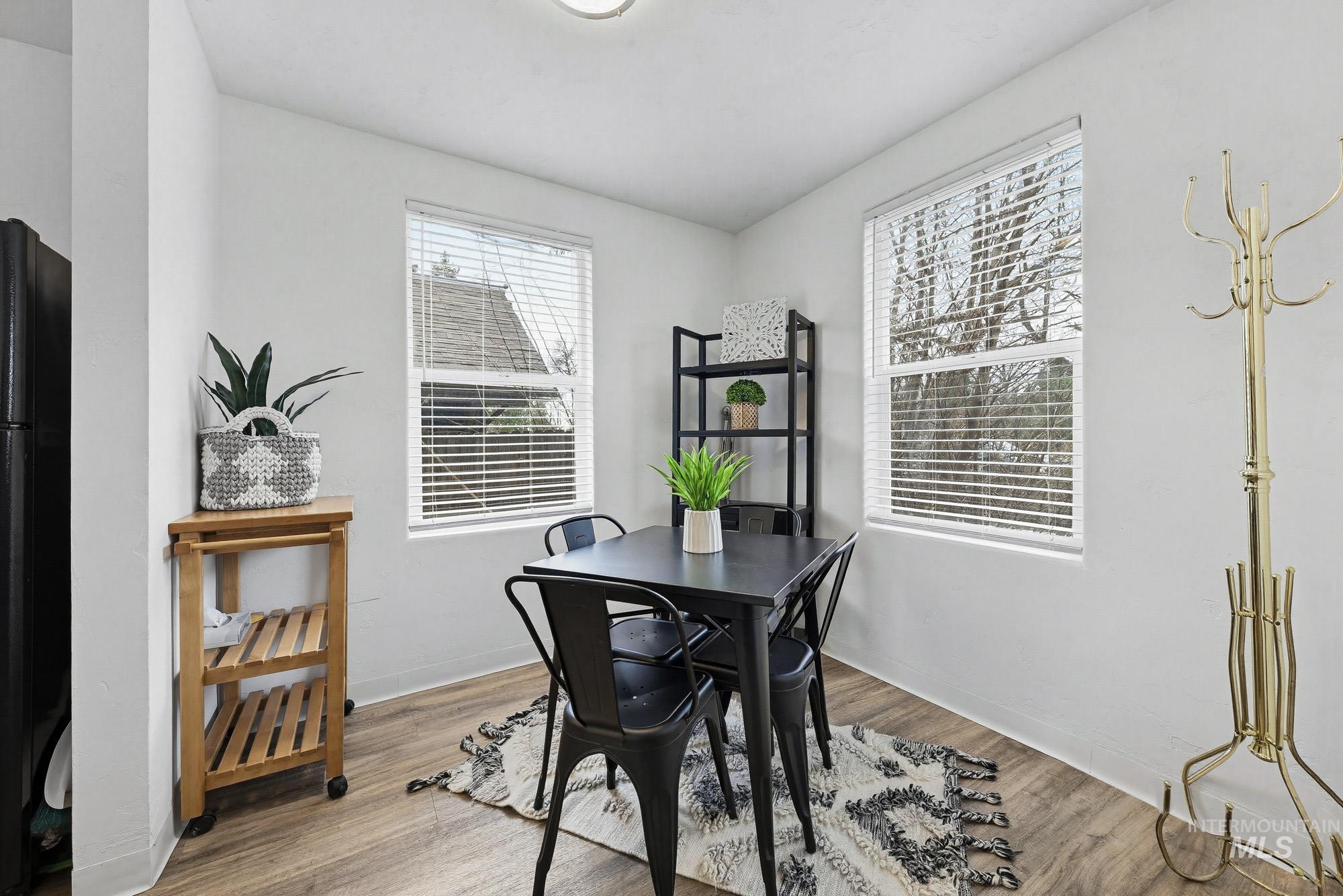 2104 North 18th Street Boise, ID 83702 - Photo 9 of 19 Dining room featuring light wood-type flooring and baseboards