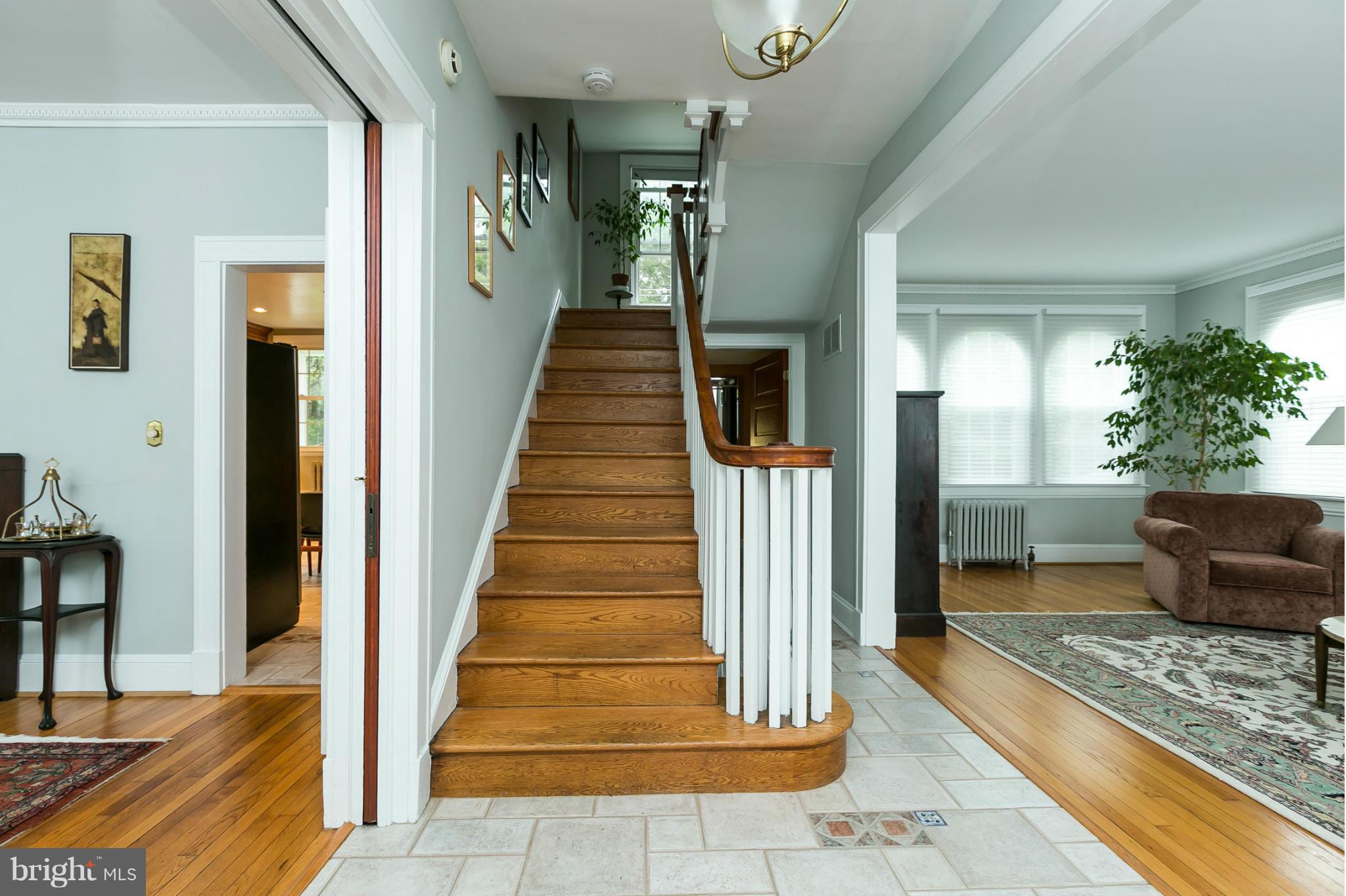 5715 Ridgedale Road Baltimore, MD 21209 - Photo 7 of 29 Beautiful staircase, pocket door to DR