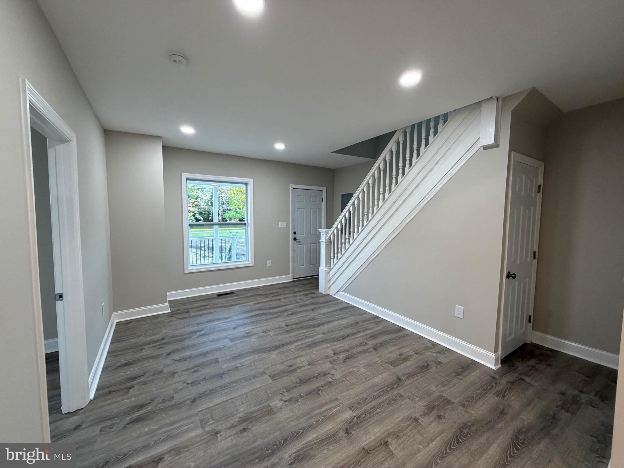 380 West Weymouth Road Vineland, NJ 08360 - Photo 2 of 10 wooden floor in an empty room with a window