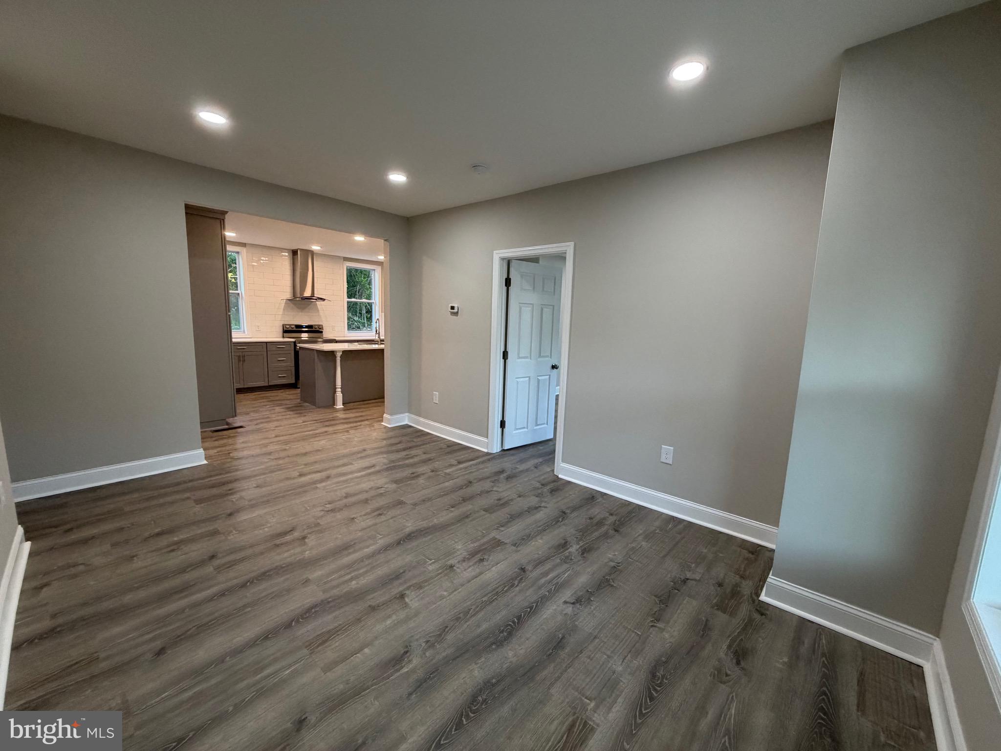 380 West Weymouth Road Vineland, NJ 08360 - Photo 3 of 10 an empty room with wooden floor and a window