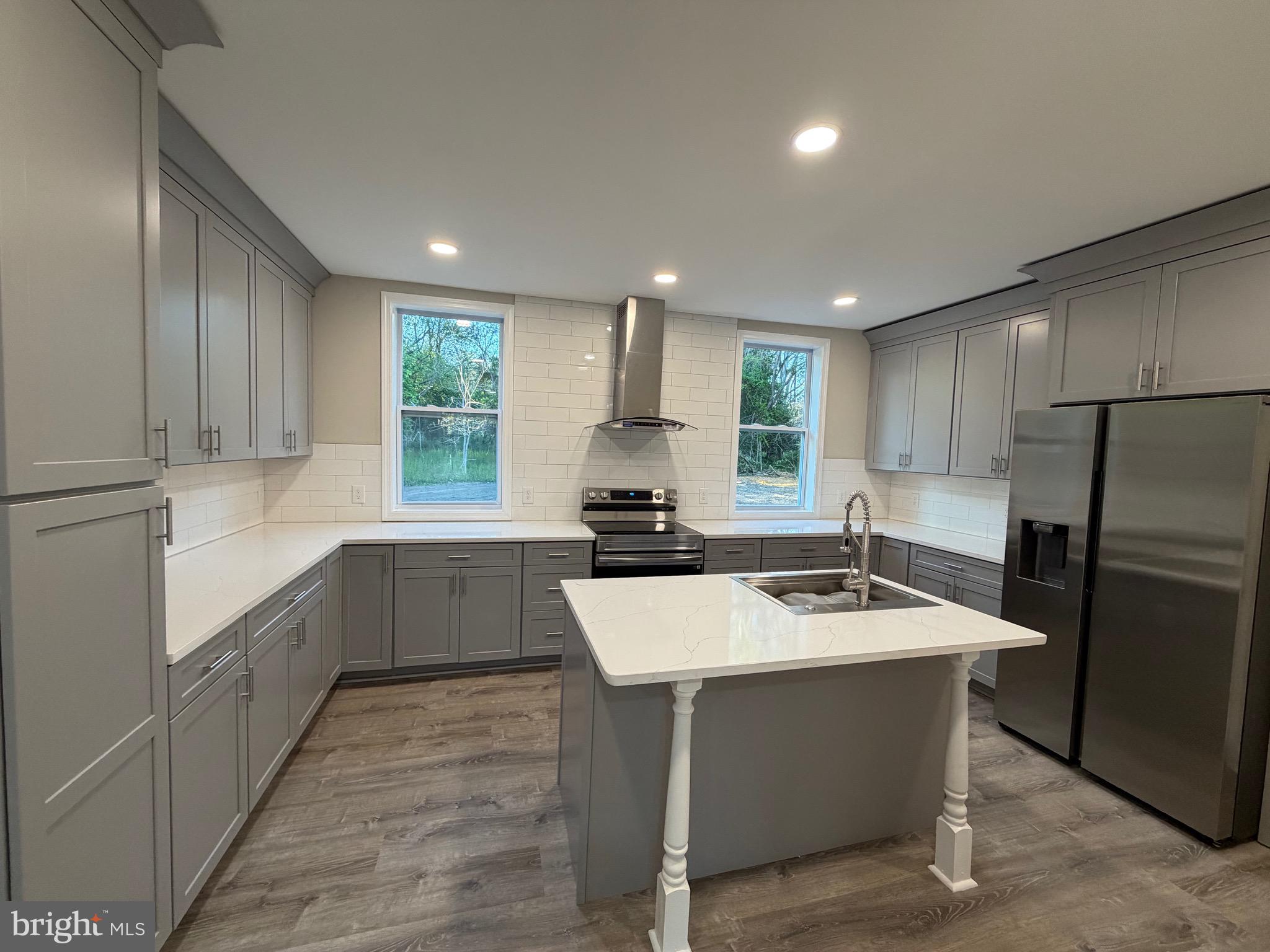 380 West Weymouth Road Vineland, NJ 08360 - Photo 4 of 10 a kitchen with a sink stove and refrigerator