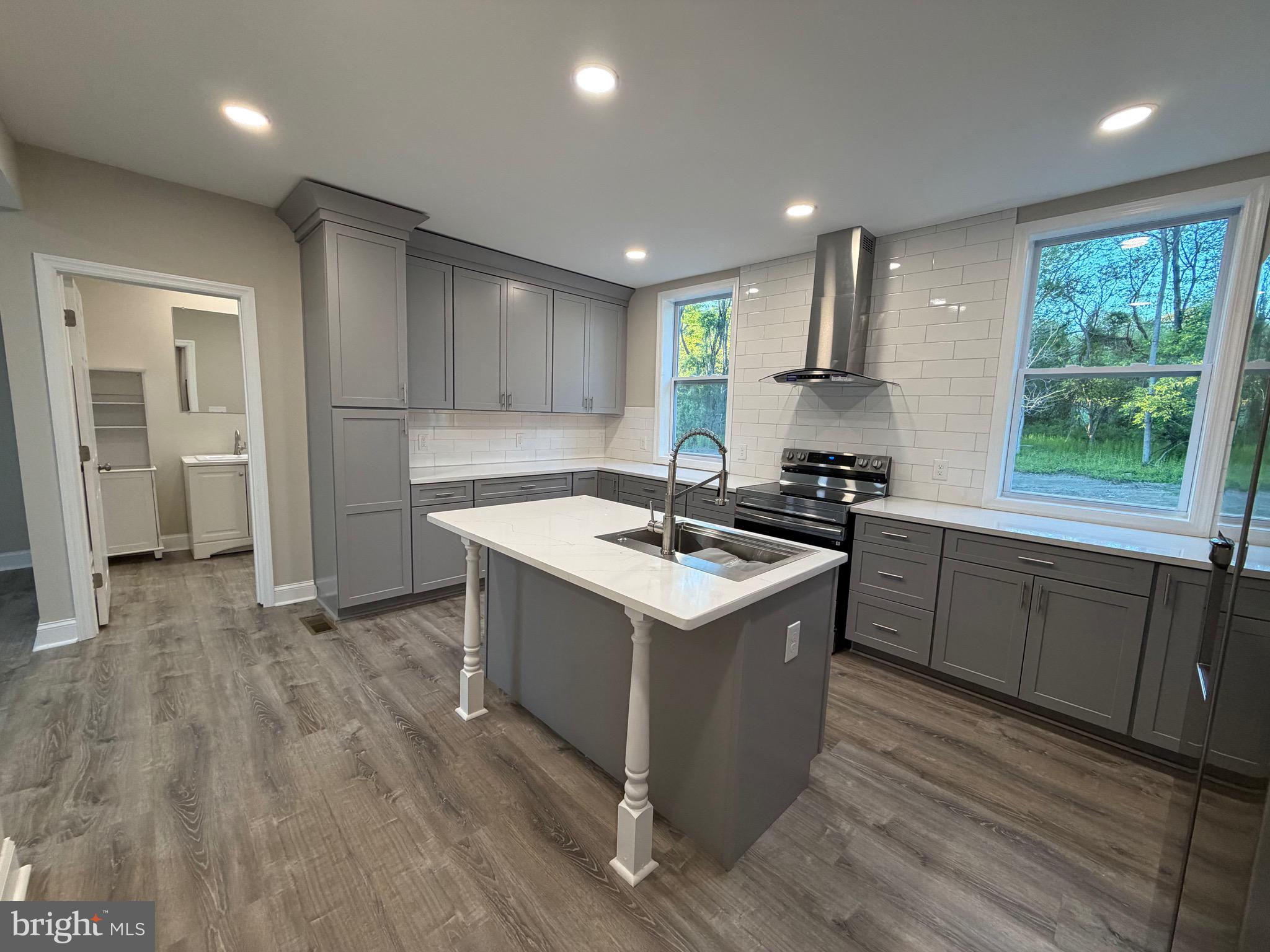 380 West Weymouth Road Vineland, NJ 08360 - Photo 5 of 10 a kitchen with a sink stove and cabinets