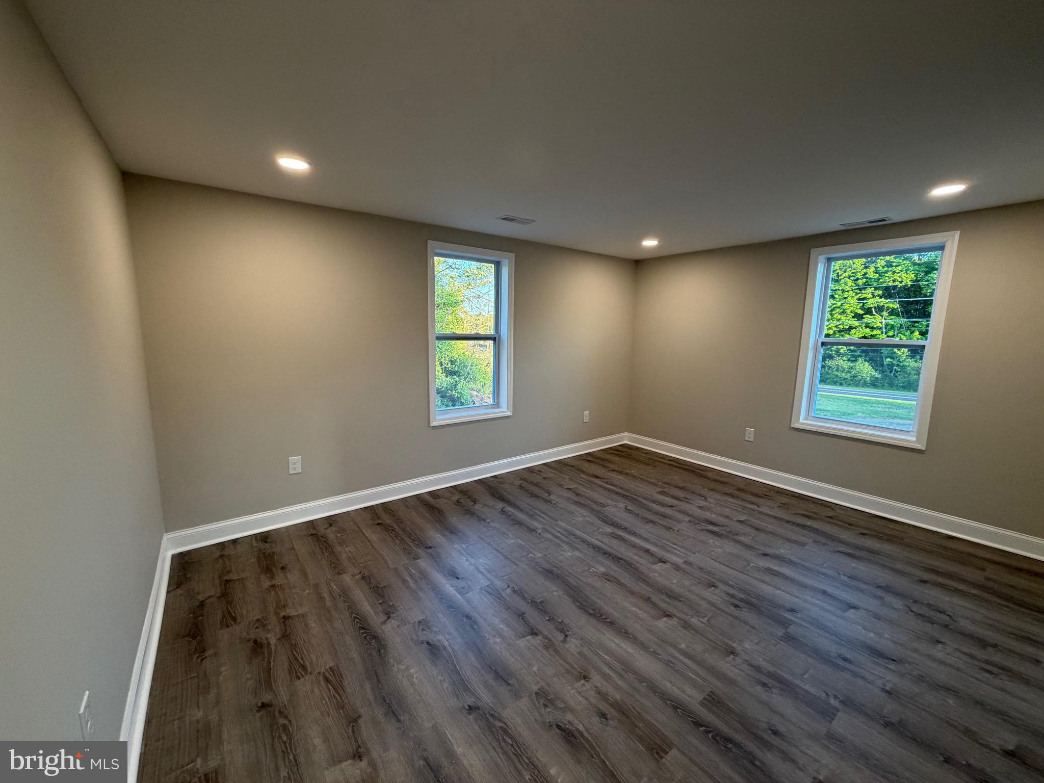 380 West Weymouth Road Vineland, NJ 08360 - Photo 9 of 10 an empty room with wooden floor and windows