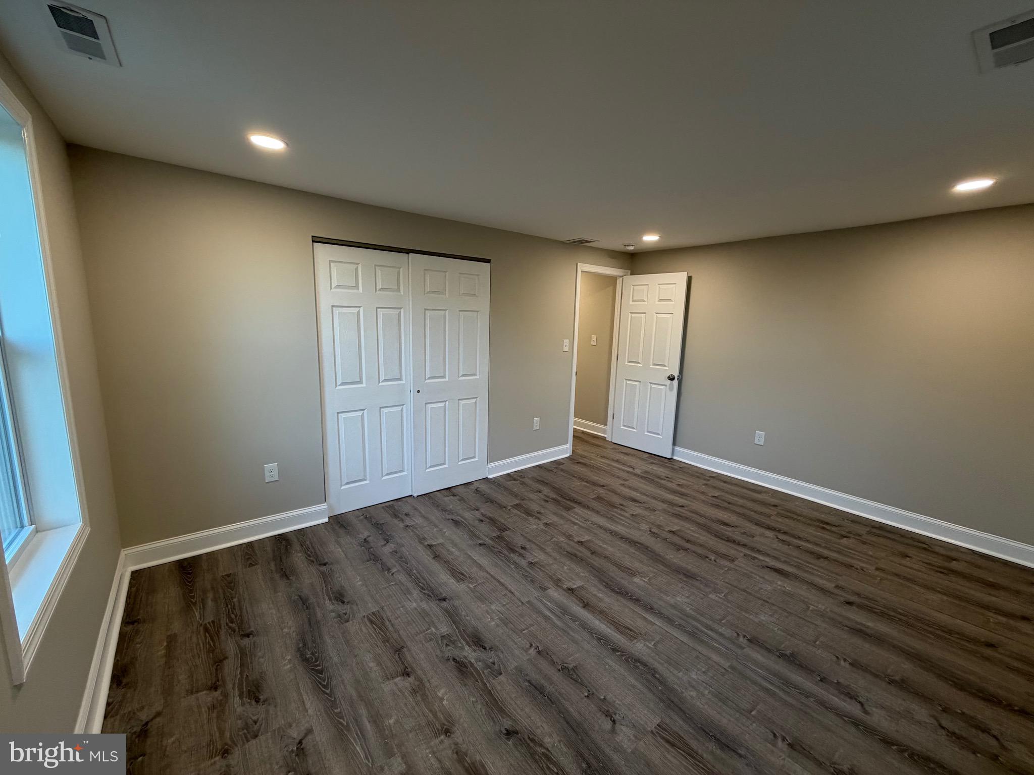 380 West Weymouth Road Vineland, NJ 08360 - Photo 10 of 10 an empty room with wooden floor and windows