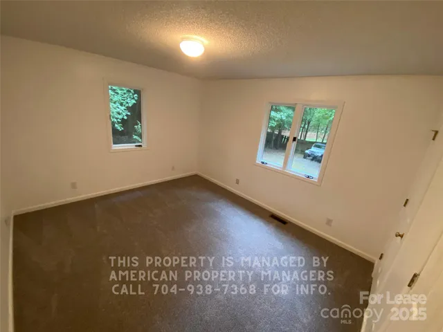 an ocean view with wooden floor and a floor to ceiling window