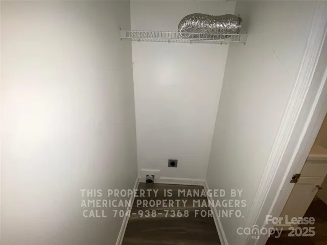 a view of a small space with racks on the wall