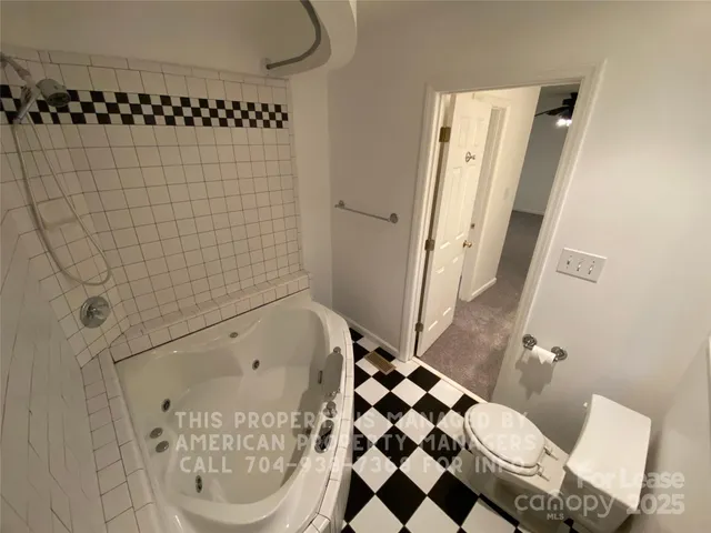 a bathroom with a bathtub and shower