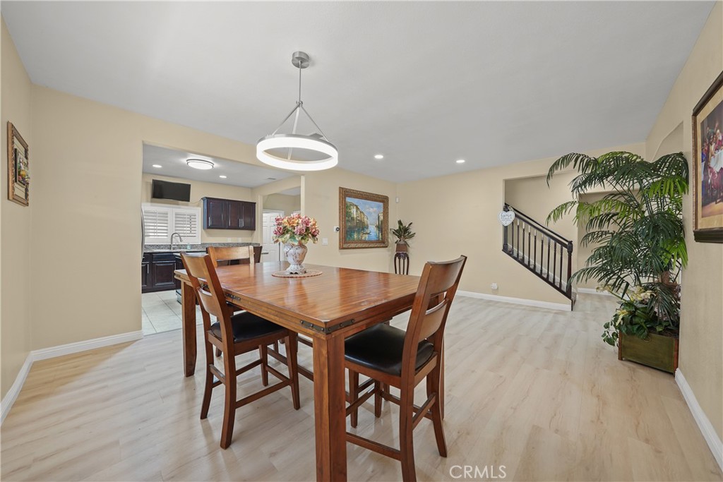 895 North Los Robles Avenue Pasadena, CA 91104 - Photo 12 of 58 a view of a dining room with furniture window and wooden floor