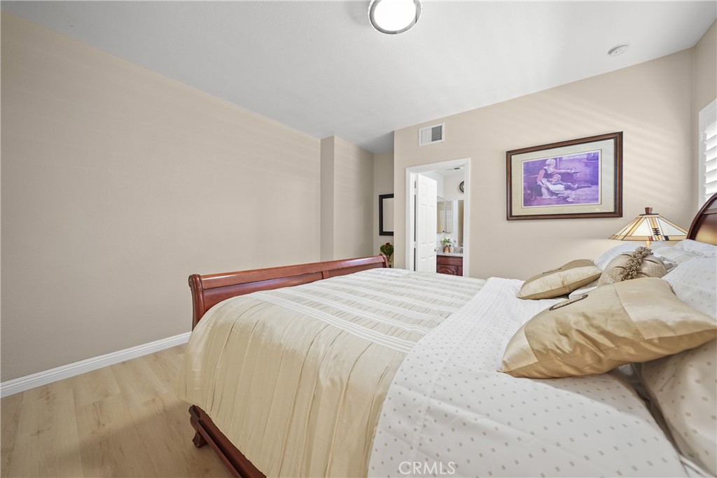 895 North Los Robles Avenue Pasadena, CA 91104 - Photo 35 of 58 a bedroom with a bed and a wall painting