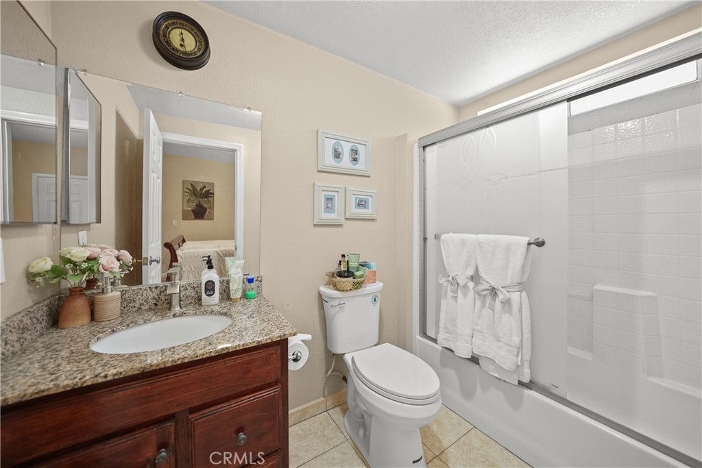 895 North Los Robles Avenue Pasadena, CA 91104 - Photo 36 of 58 a bathroom with a granite countertop sink and a mirror