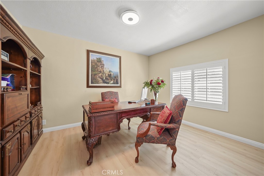 895 North Los Robles Avenue Pasadena, CA 91104 - Photo 37 of 58 a view of a workspace with furniture and a window