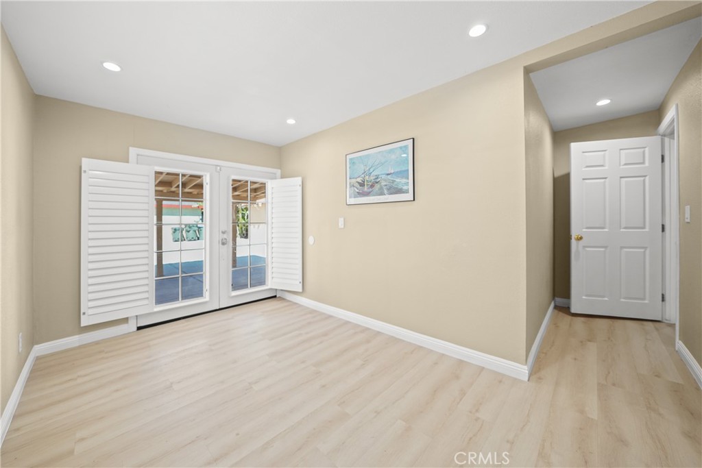 895 North Los Robles Avenue Pasadena, CA 91104 - Photo 43 of 58 a view of an empty room with wooden floor and a window
