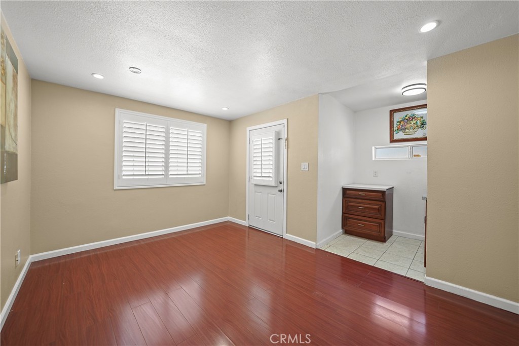 895 North Los Robles Avenue Pasadena, CA 91104 - Photo 44 of 58 an empty room with wooden floor and windows