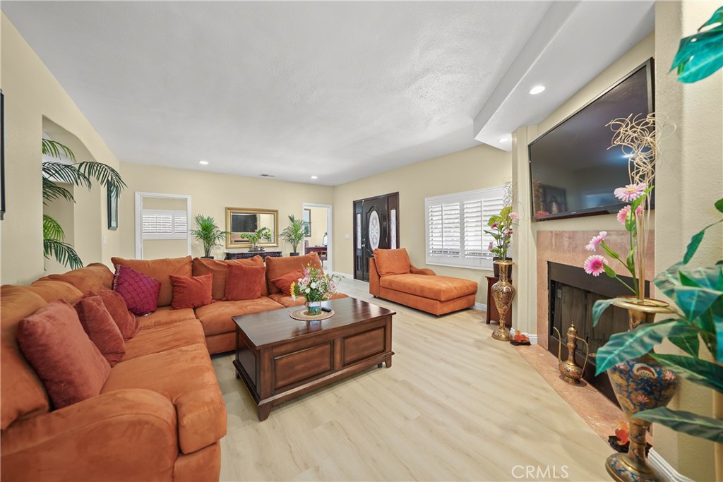 895 North Los Robles Avenue Pasadena, CA 91104 - Photo 9 of 58 a living room with furniture flat screen tv and a fireplace