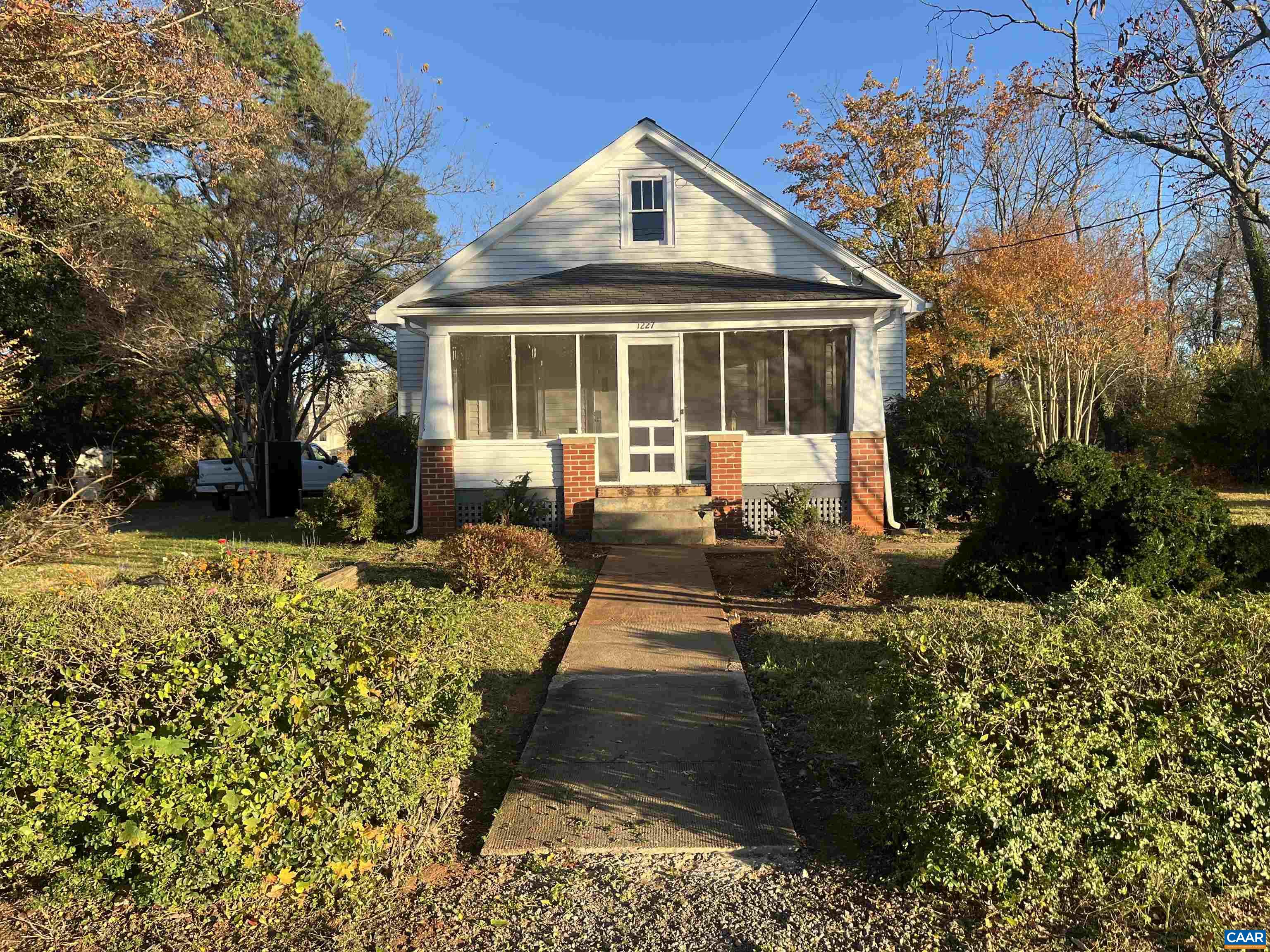 1227 Blue Ridge Avenue Crozet, VA 22932 - Photo 1 of 17 a front view of a house with a yard