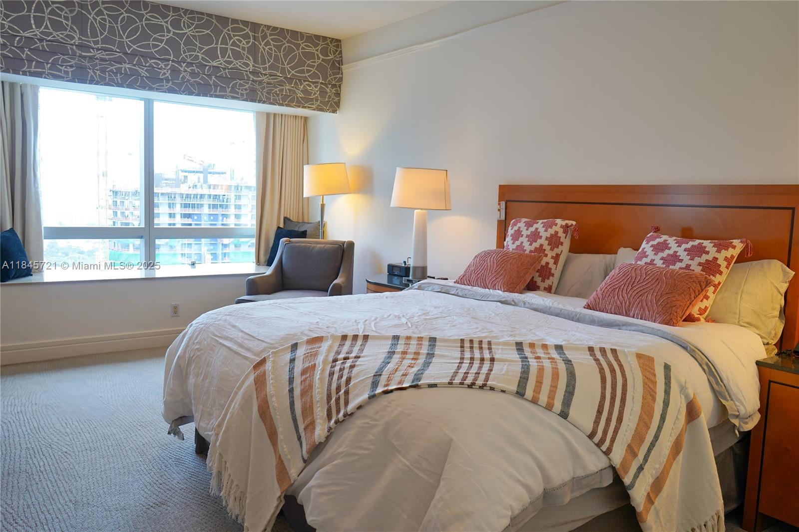 1435 Brickell Avenue, Unit 3412 Miami, FL 33131 - Photo 14 of 44 a bedroom with a bed and a large window