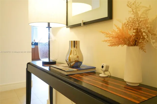 a view of a room with a table and chairs