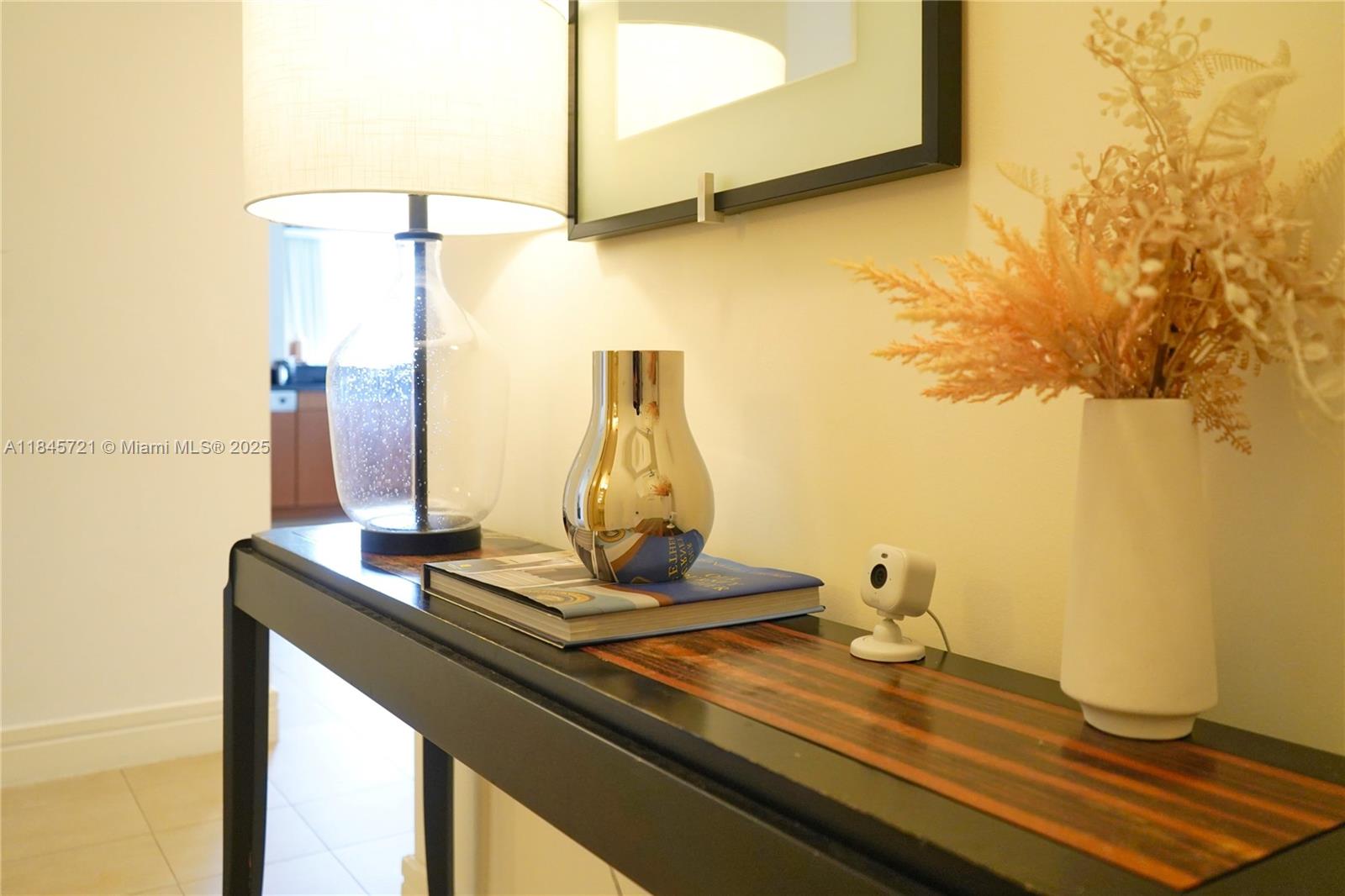 1435 Brickell Avenue, Unit 3412 Miami, FL 33131 - Photo 16 of 44 a view of a room with a table and chairs