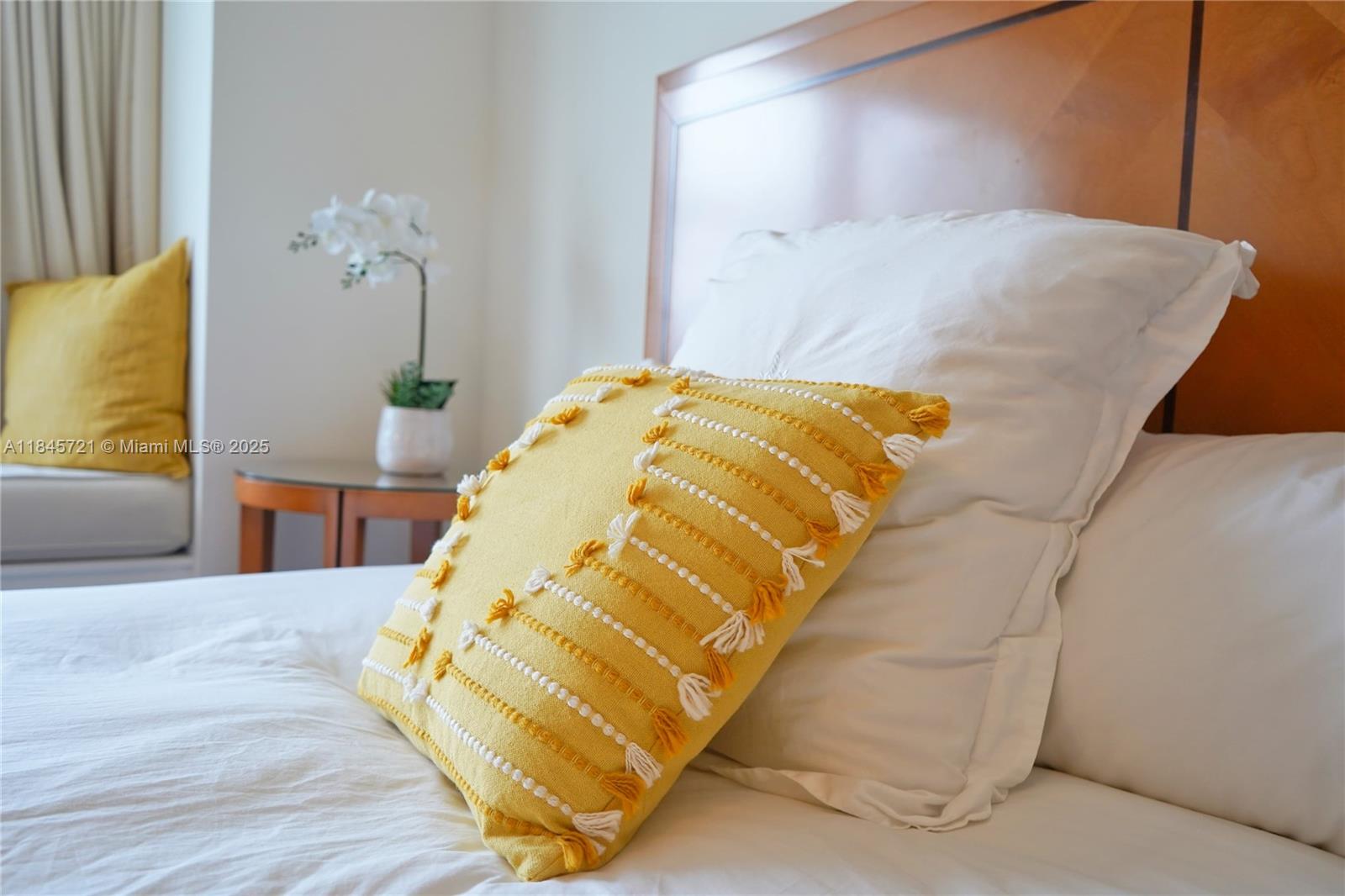 1435 Brickell Avenue, Unit 3412 Miami, FL 33131 - Photo 19 of 44 a bed sitting in a bedroom next to a window