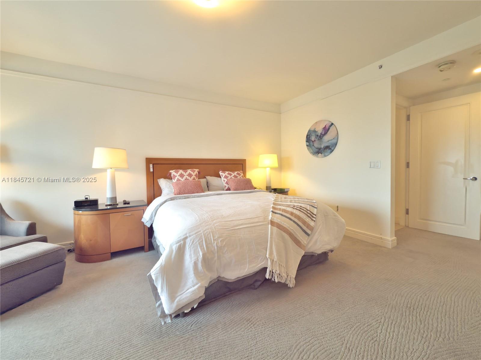 1435 Brickell Avenue, Unit 3412 Miami, FL 33131 - Photo 26 of 44 a bed room with a bed and a couch