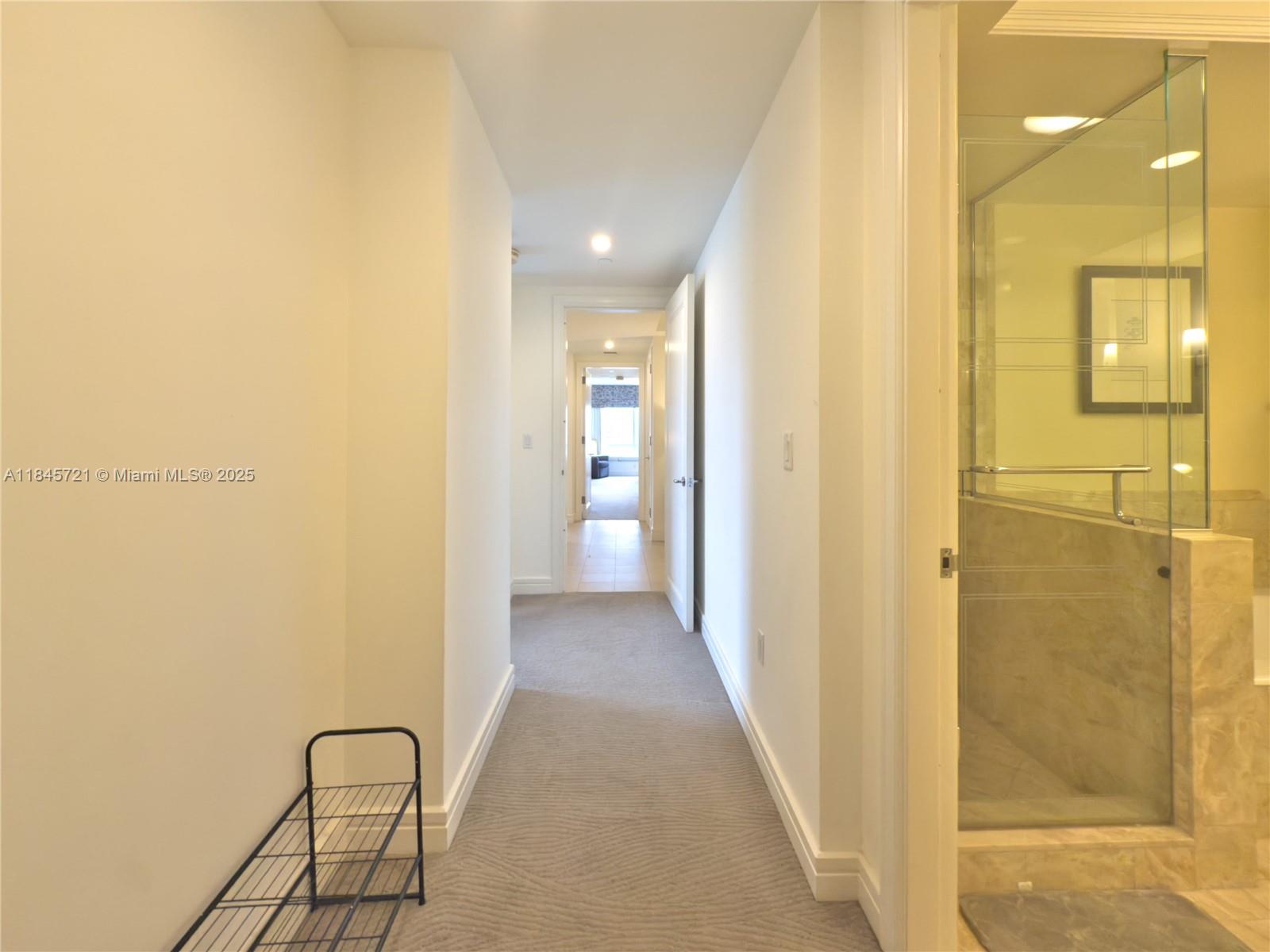 1435 Brickell Avenue, Unit 3412 Miami, FL 33131 - Photo 31 of 44 a view of a bathroom from a corridor