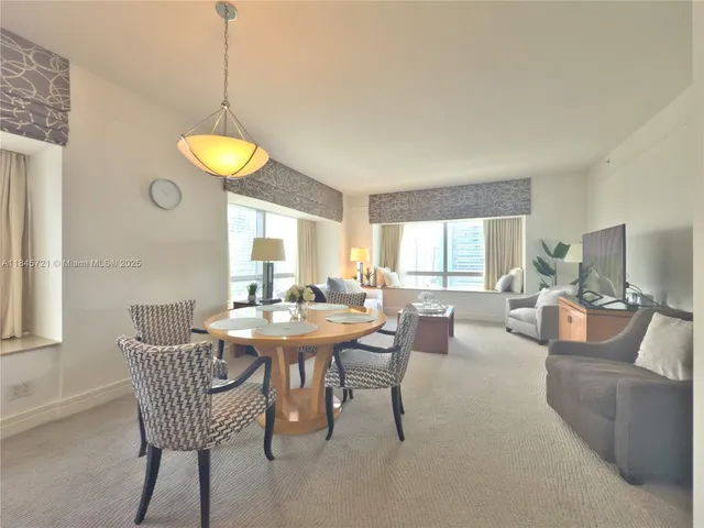 a view of a dining room with furniture window and outside view