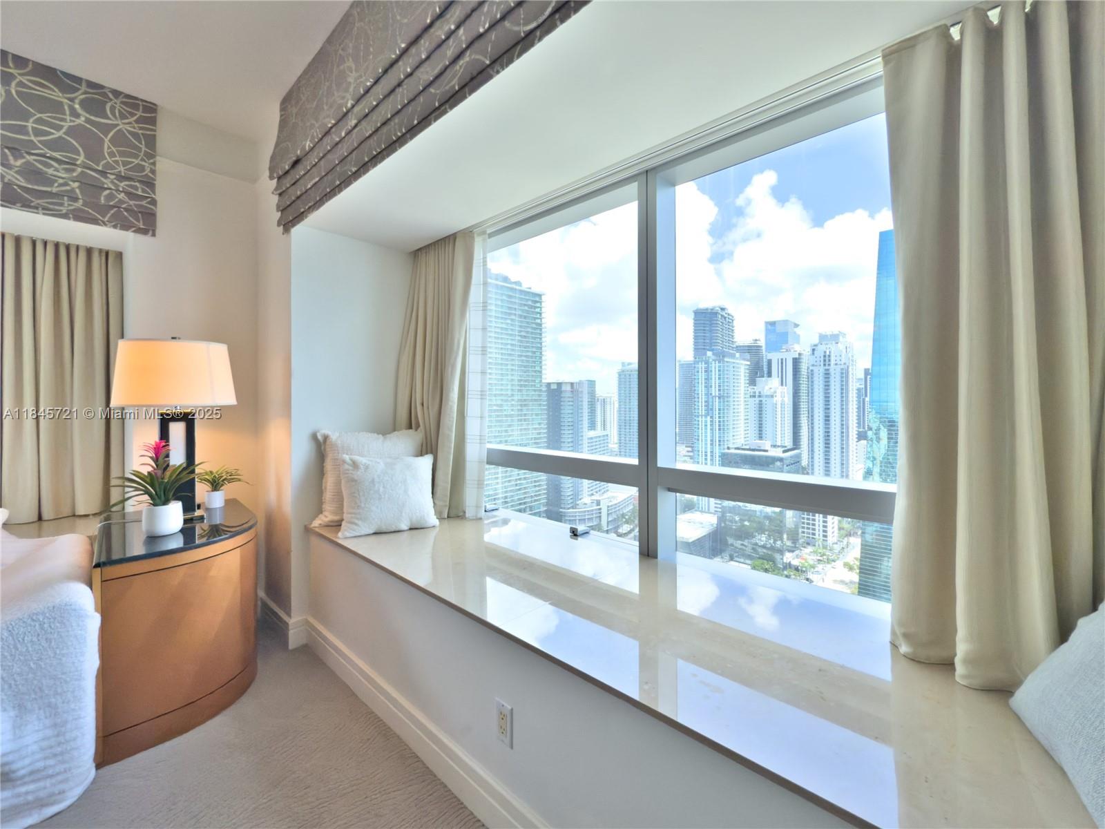 1435 Brickell Avenue, Unit 3412 Miami, FL 33131 - Photo 40 of 44 a room with window and view of living room