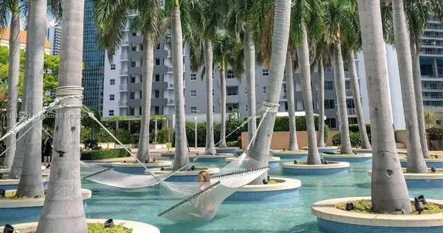 a view of a swimming pool with a sitting area
