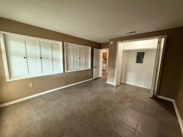 an empty room with windows