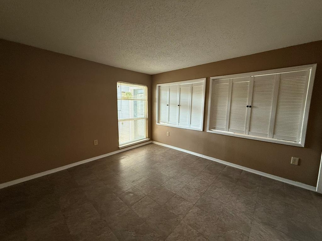 9696 Walnut Street, Unit 606 Dallas, TX 75243 - Photo 12 of 17 an empty room with windows
