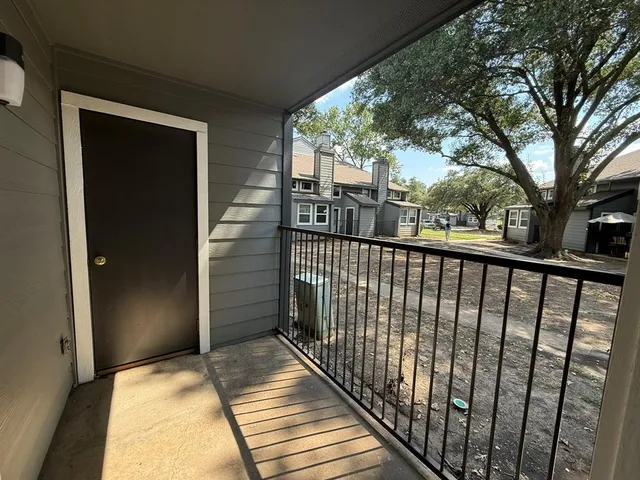 a view of a house with a iron gate
