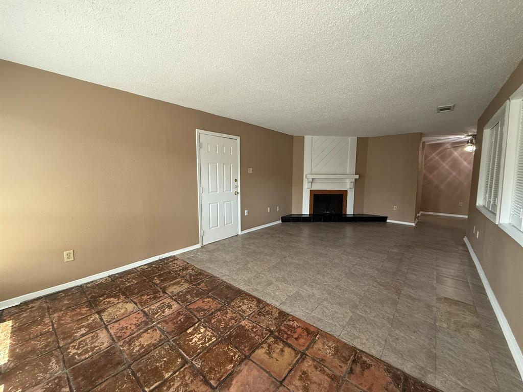 9696 Walnut Street, Unit 606 Dallas, TX 75243 - Photo 4 of 17 a view of empty room with wooden floor
