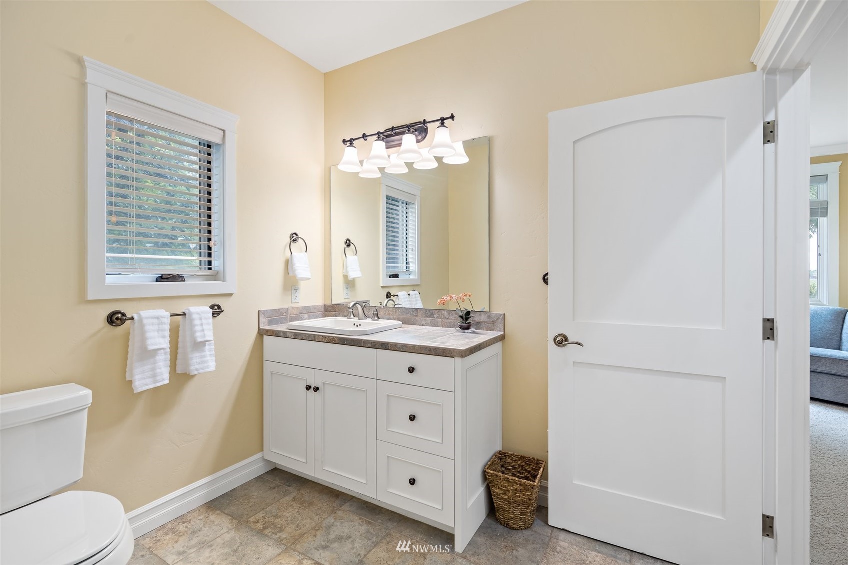 273 Galloway Road Touchet, WA 99360 - Photo 19 of 39 a bathroom with a granite countertop sink a toilet and a mirror